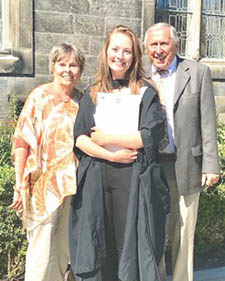 Cypress Cove residents Schmitts with grandaughter at graduation from the University of St. Andrews in Scotland