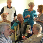 Walter Siewert plays the accordion at Cypress Cove